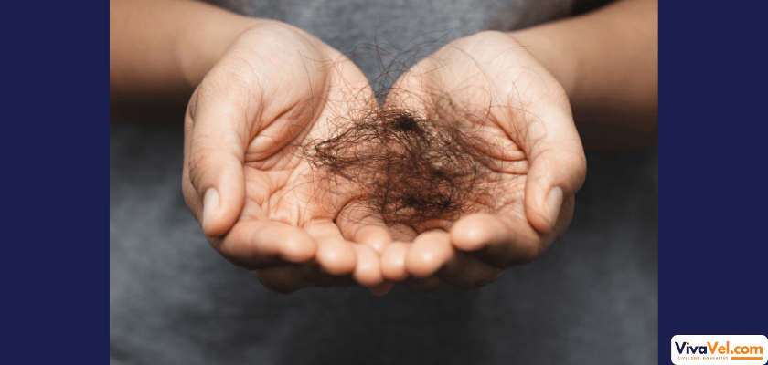 Concerned woman holding broken hair strands in her hands, showing signs of hair fall during monsoon season – VivaVel Hair Care Guide